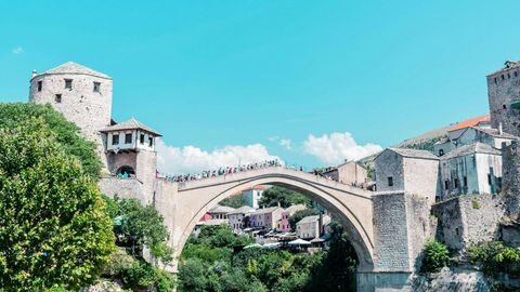 The Stari Most stone bridge arching over the green Neretva River in Mostar
