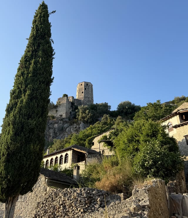 The medieval stone city of Pocitelj built into a limestone hillside above the Neretva River